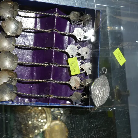 Silver spoons and pendant