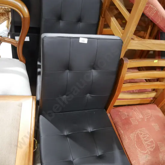 Two black dining chairs