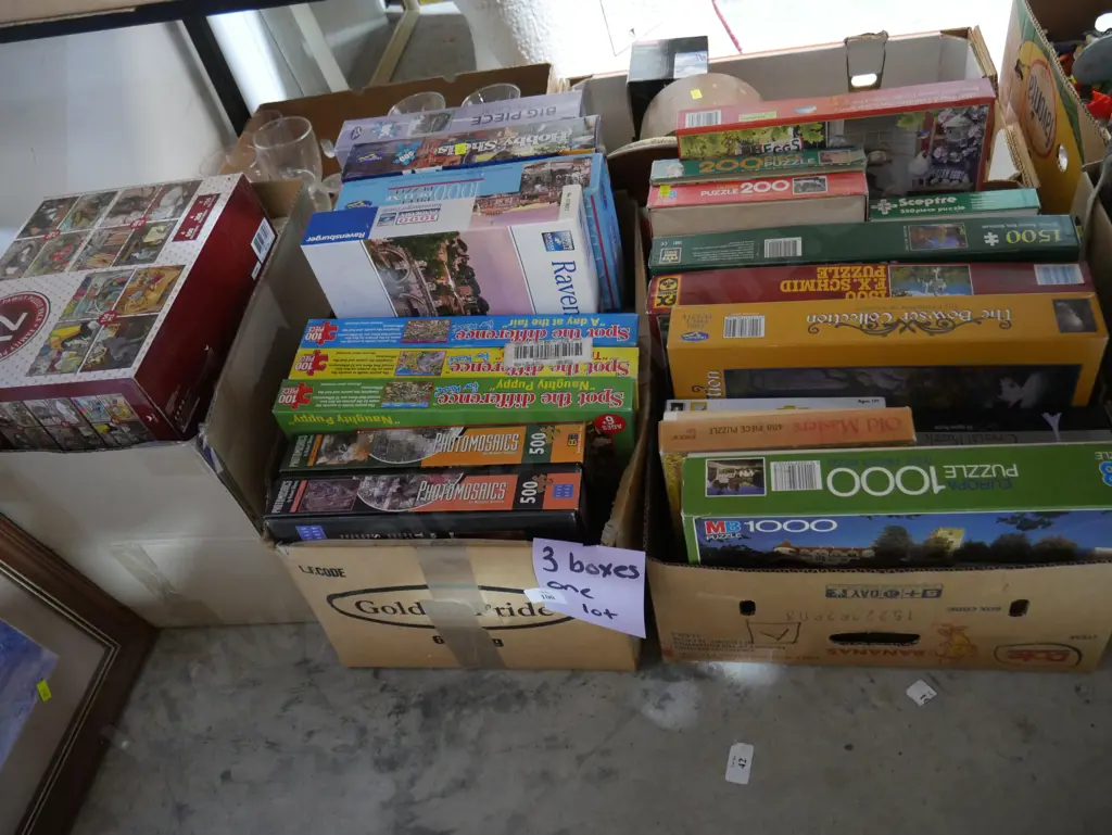 Three boxes of jigsaws Image 1++