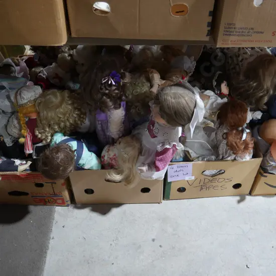4 boxes of dolls