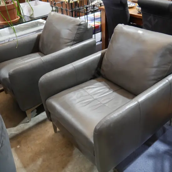 Pair of leather arm chairs