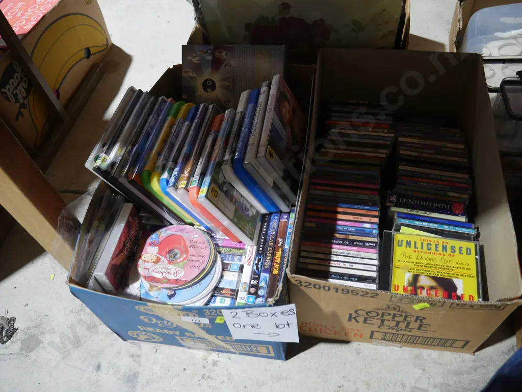 Two boxes of CDs and DVDs Image 1++