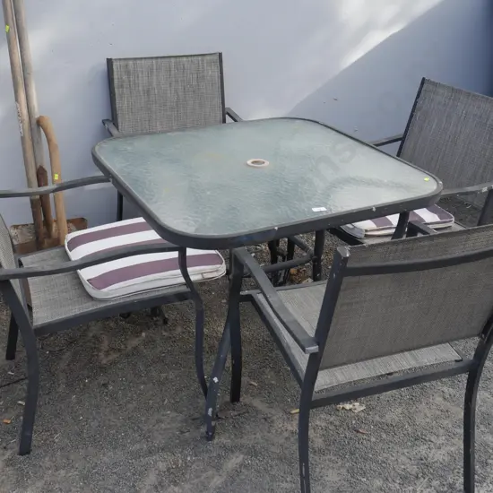 Glass top outdoor table and four chairs