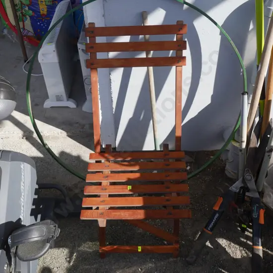 Green metal hoop and folding chair