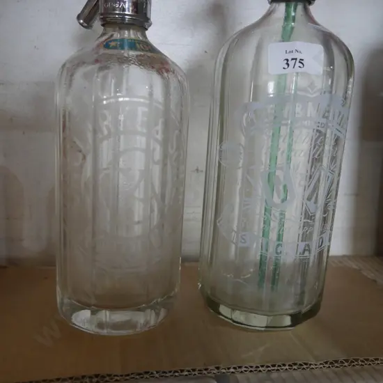 Two soda siphons