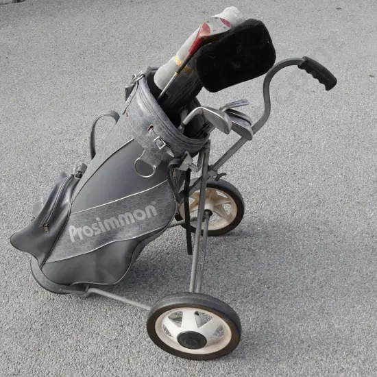 Golf clubs, bag and trundler