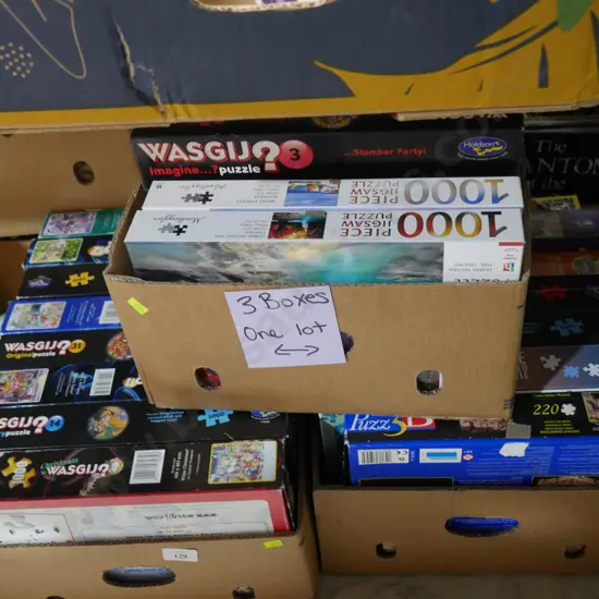 Three boxes of jigsaw puzzles