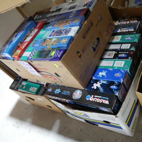 Three boxes of jigsaw puzzles