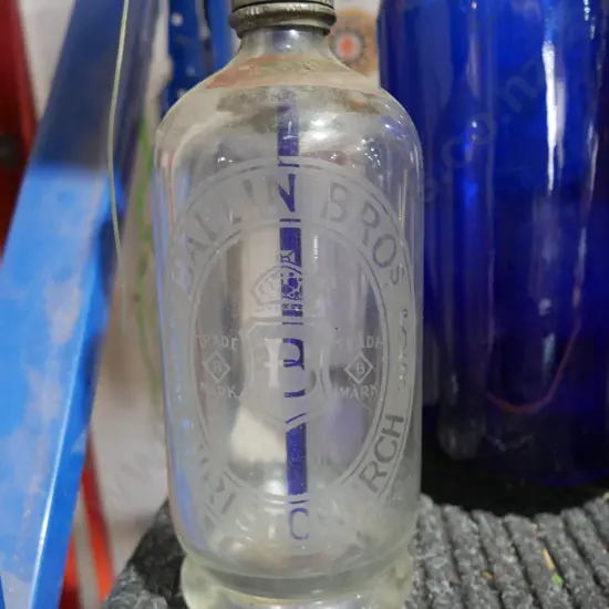 Glass bottles and soda siphon
