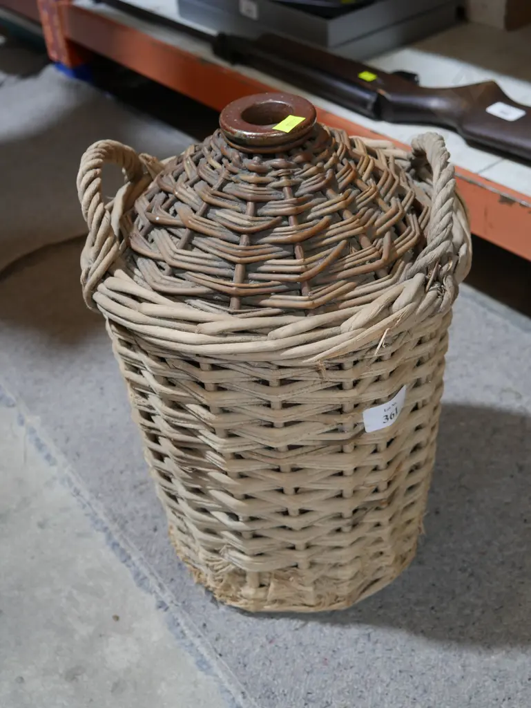 Wicker covered stone jar Image 1++