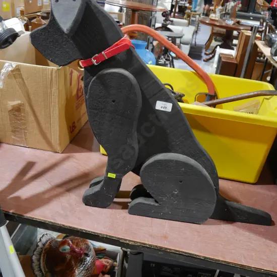 Wooden sitting dog sculpture