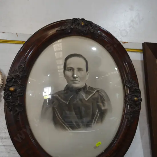 Oval framed lady photograph