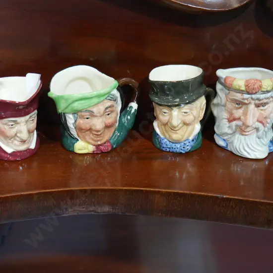 Four small Royal Doulton Toby's