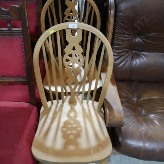 Pair of wheel back wooden chairs