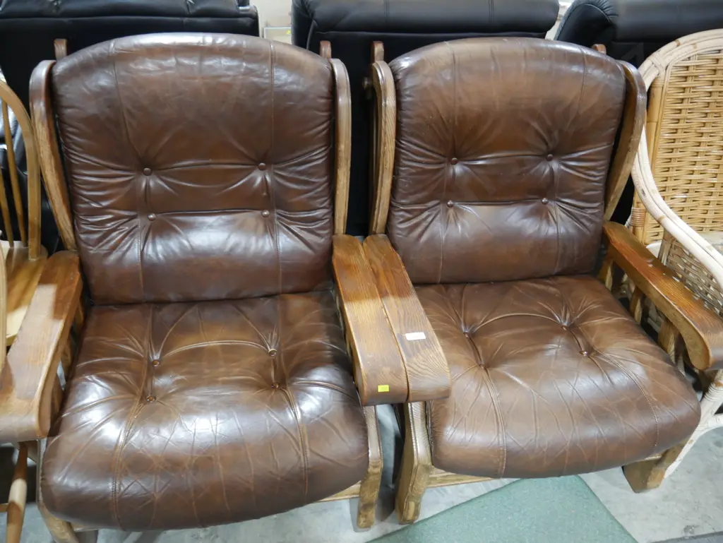 Pair of brown leather and wood armchairs Image 1++