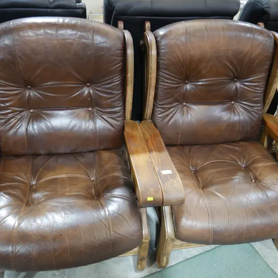 Pair of brown leather and wood armchairs