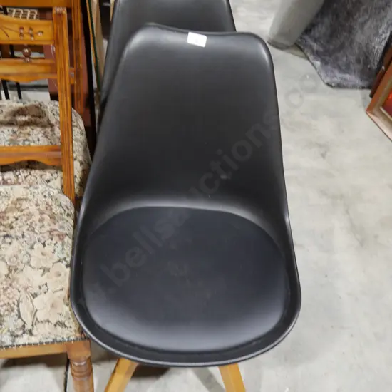 2 modern black chairs