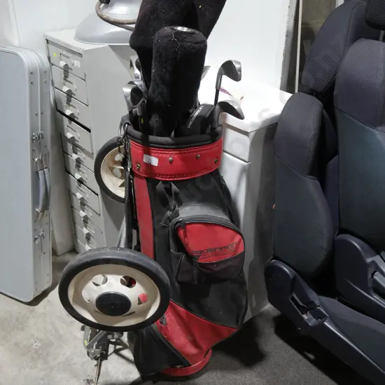 Golf clubs, bag and trundler