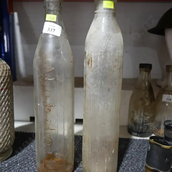 Mobil and Shell oil bottles