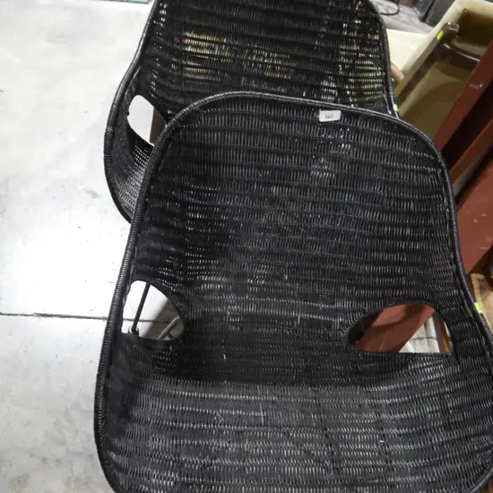 Pair of black wicker chairs
