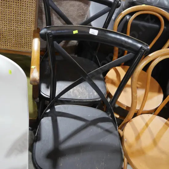 2 black wooden dining chairs