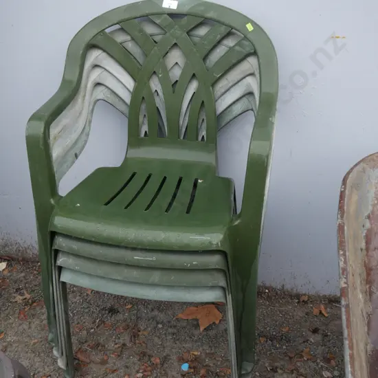 4 green plastic chairs