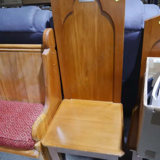 High back chair with silver plaque
