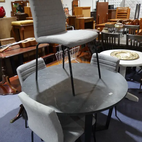 Round modern dining table and four chairs