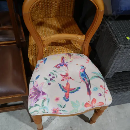 Balloon back chair with bird upholstery