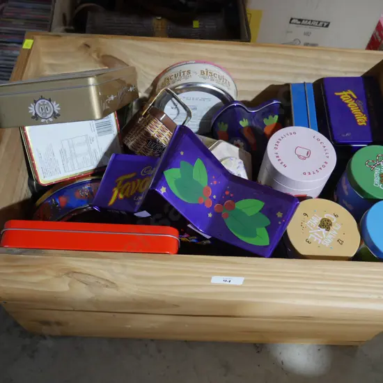 Wooden box of tins
