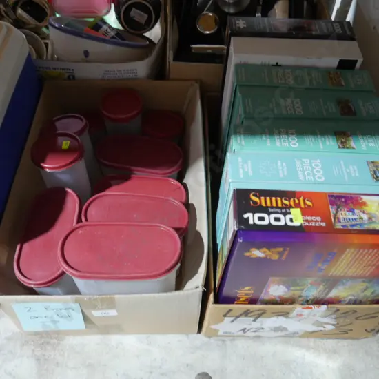 2 boxes of jigsaw puzzles and plastic containers