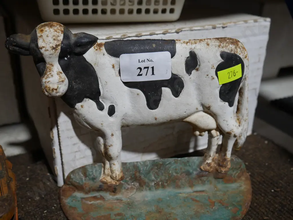 Cast iron cow door stop Image 1++