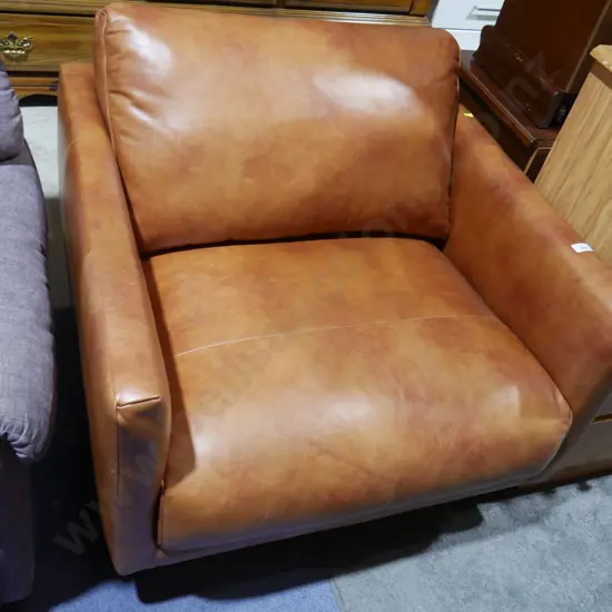 Tan leather arm chair