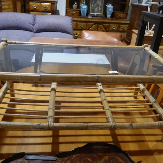Glass top cane coffee table