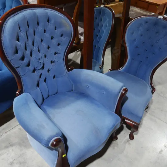 Two deep button armchairs