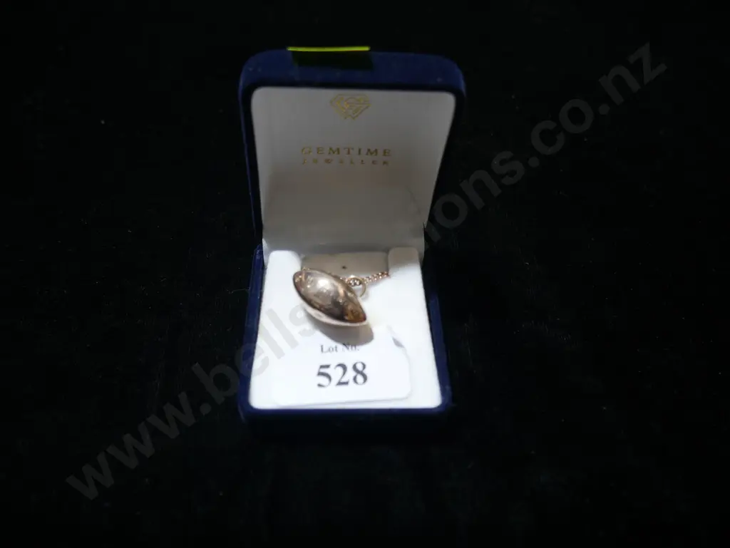 Gold rugby ball pendant Image 1++