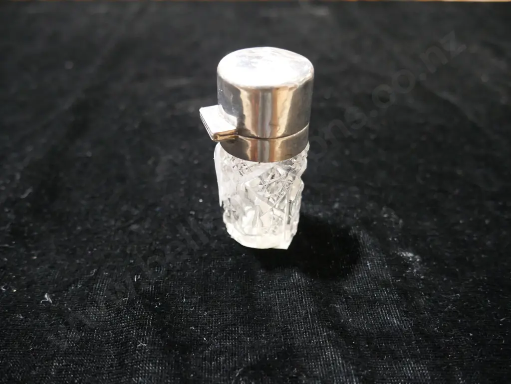 Silver top perfume bottle Image 1++