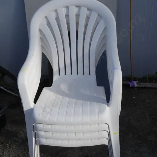 Set of 4 white plastic chairs