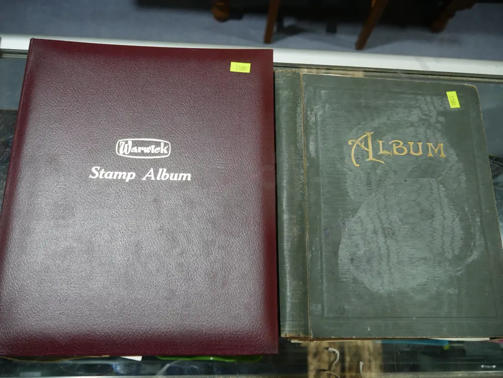 Two stamp albums and stamps Image 1++