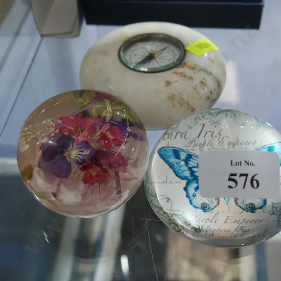 Glass paperweights and compass