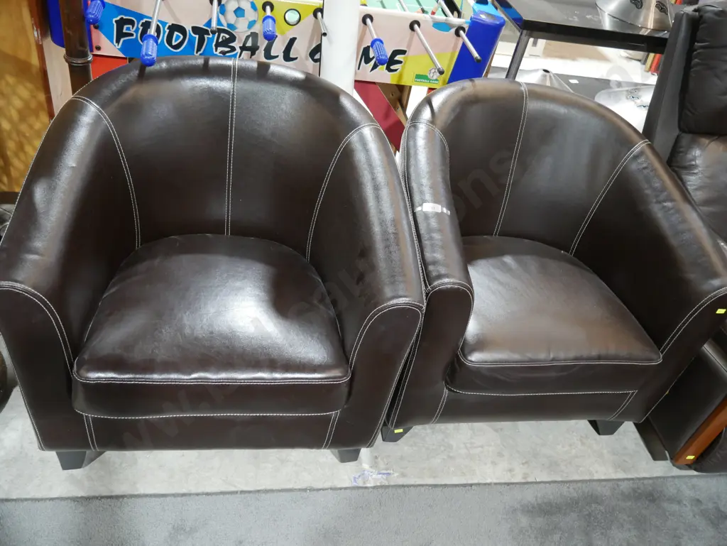 Pair of brown leather tub chairs Image 1++