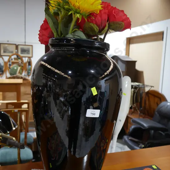 Large black vase and artificial flowers