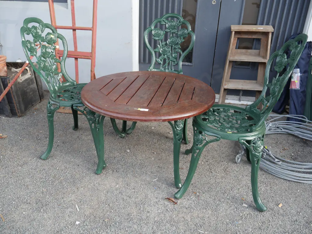 Quality wooden table and 3 cast chairs Image 1++