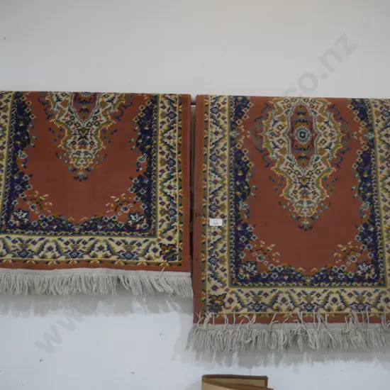 Two floor rugs