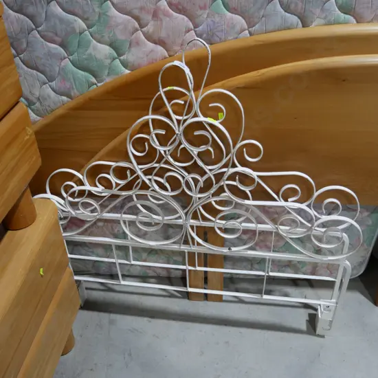 Two single wrought iron headboards