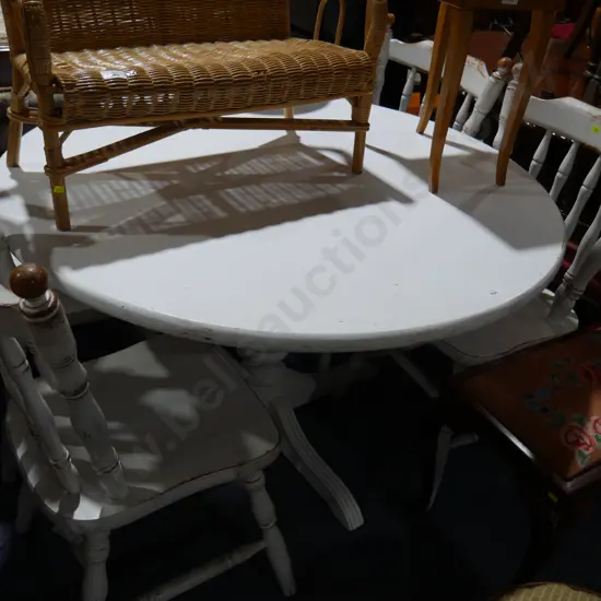 White round dining table and four chairs
