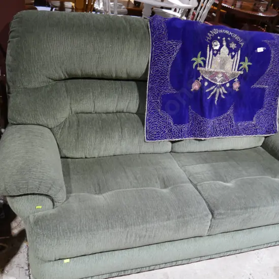 Green two-seater sofa