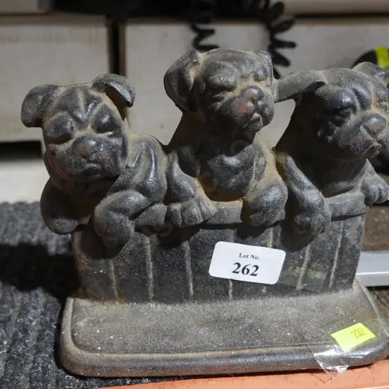 Cast dog door stop