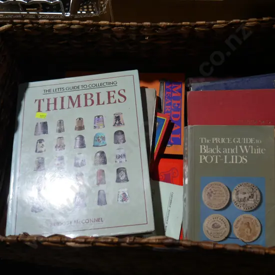 Cane basket, guide books etc