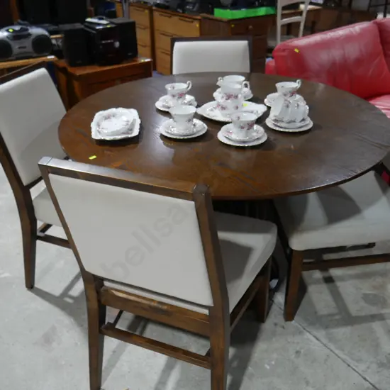 Circular dining table and four chairs